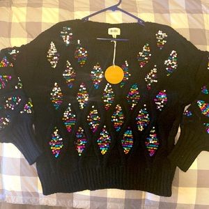 A show stopping sweater - new w/ tags. Size medium with a relaxed fit.